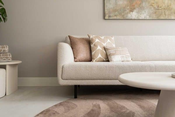 Vloerkleed in natuurlijke tinten als verbindend element in het interieur